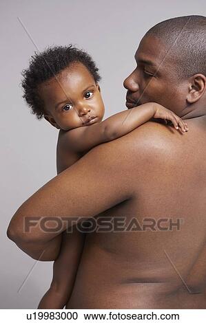 Father hugging baby View Large Photo Image Stock Image - Father hugging baby. Fotosearch