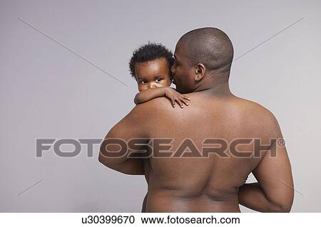 Father hugging baby View Large Photo Image Stock Image - Father hugging baby. Fotosearch