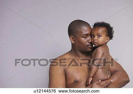 Father hugging baby View Large Photo Image Stock Photograph - Father hugging baby. Fotosearch
