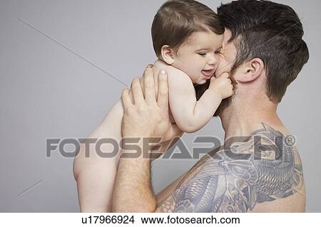 Father lifting baby View Large Photo Image Picture - Father lifting baby. Fotosearch