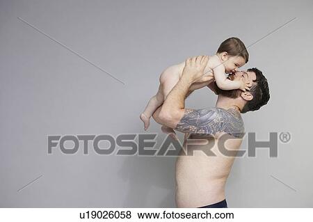 Stock Photo - Father lifting baby. Fotosearch