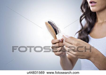 Stock Photo - Female hairloss. Fotosearch