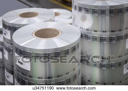 Stock Image - Finished printed food packaging in print factory. Fotosearch