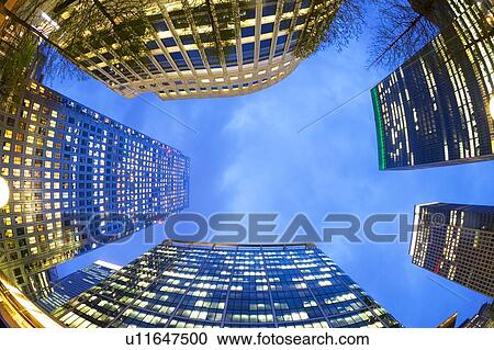 Stock Image - Fisheye view of office buildings at dusk. Fotosearch
