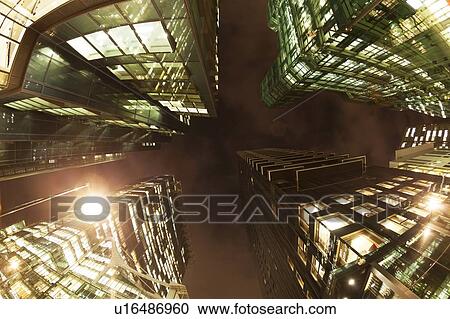 Stock Image - Fisheye view of office buildings at dusk. Fotosearch