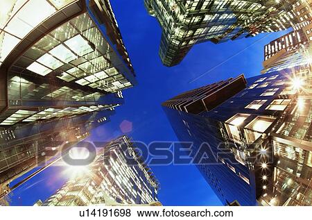 Stock Photo - Fisheye view of office buildings at dusk. Fotosearch