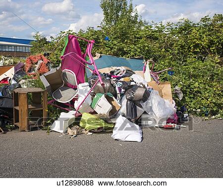 Stock Photo - Fly tipping of household waste. Fotosearch