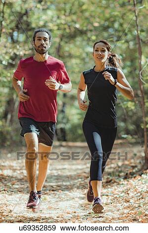 Friends enjoy running outdoors View Large Photo Image Stock Photo - Friends enjoy running outdoors. Fotosearch