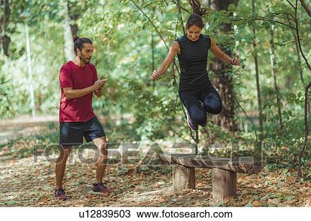 Friends exercising in the park View Large Photo Image Stock Image - Friends exercising in the park. Fotosearch