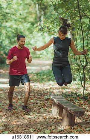 Friends exercising in the park View Large Photo Image Stock Image - Friends exercising in the park. Fotosearch