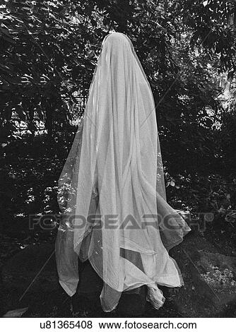Stock Photo - Ghost by trees. Fotosearch