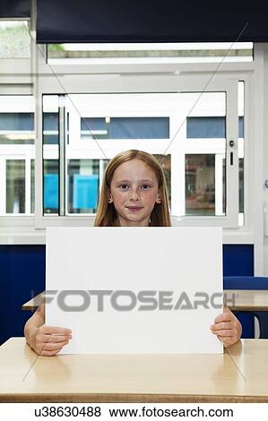 Stock Photo - Girl holding up blank placard. Fotosearch