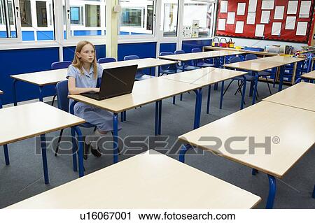 Stock Image - Girl in classroom. Fotosearch