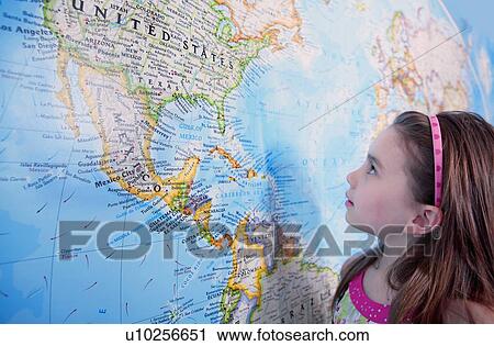 Girl looking at map of the USA View Large Photo Image Stock Image - Girl looking at map of the USA. Fotosearch