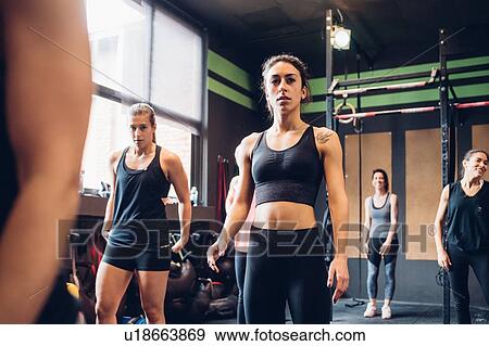 Stock Photo - Group of women training in gym, portrait. Fotosearch