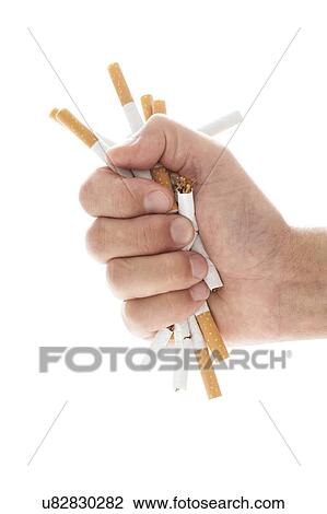 Stock Image - Hand crushing cigarettes. Fotosearch
