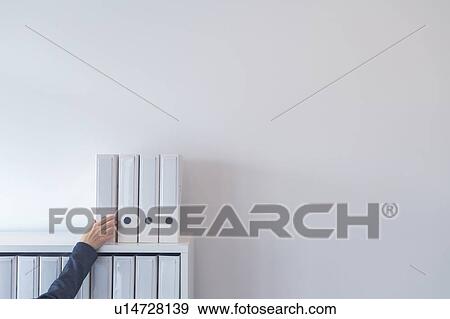 Hand reaching for files View Large Photo Image Stock Photo - Hand reaching for files. Fotosearch