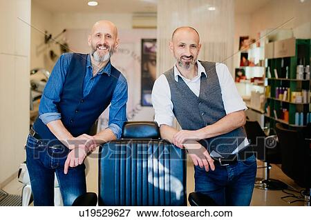 Happy business partners in barber shop View Large Photo Image Stock Photo - Happy business partners in barber shop. Fotosearch