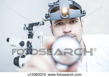 Indirect ophthalmoscope eye examination View Large Photo Image Stock Image - Indirect ophthalmoscope eye examination. Fotosearch
