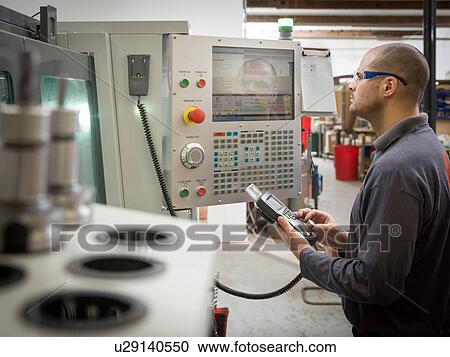Knife factory worker operating machinery controls View Large Photo Image Stock Image - Knife factory worker operating machinery controls. Fotosearch