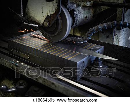 Stock Photography - Knife on factory machinery in workshop. Fotosearch