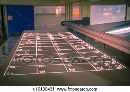 Stock Image - Laser test print out on print bed in laser printer in print factory. Fotosearch