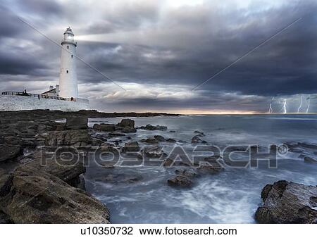 Stock Image - Lighthouse during a storm. Fotosearch