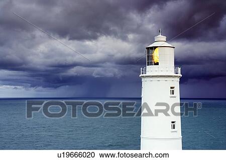 Stock Image - Lighthouse during a storm. Fotosearch