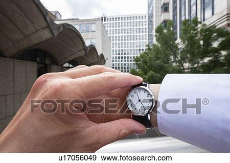 Looking at watch View Large Photo Image Stock Photo - Looking at watch. Fotosearch