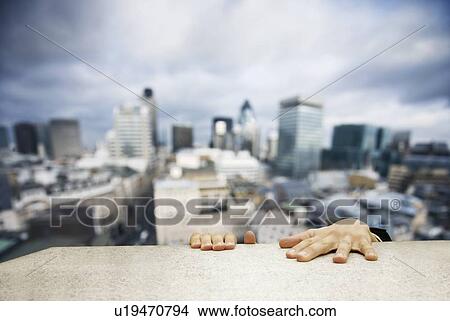 Man hanging on to building ledge View Large Photo Image Picture - Man hanging on to building ledge. Fotosearch