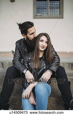 Man kissing hair and hugging woman from behind on steps View Large Photo Image Stock Image - Man kissing hair and hugging woman from behind on steps. Fotosearch