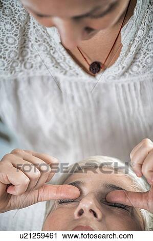 Stock Image - Marma therapy ayurveda eyes treatment urdhaw and adhoakshi. Fotosearch