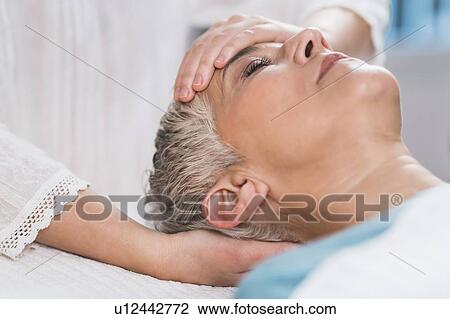 Stock Image - Marma therapy ayurveda face therapy. Fotosearch