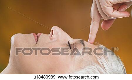 Stock Photo - Marma therapy ayurveda face therapy. Fotosearch