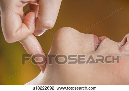 Stock Image - Marma therapy ayurveda facial massage. Fotosearch