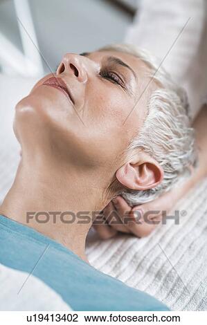Stock Image - Marma therapy ayurveda head massage. Fotosearch