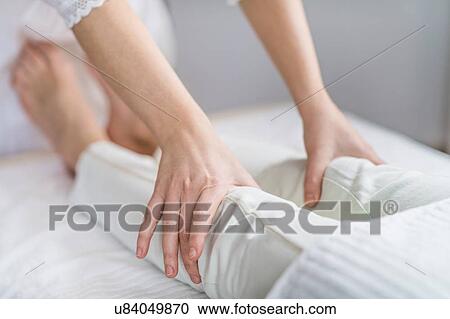 Stock Image - Marma therapy ayurveda knee treatment. Fotosearch
