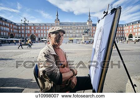 Mature male street artist by drawing canvas in town square, portrait, Madrid, Spain View Large Photo Image Stock Photo - Mature male street artist by drawing canvas in town square, portrait, Madrid, Spain. Fotosearch
