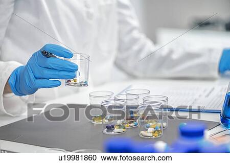 Medical researcher testing new medicine View Large Photo Image Stock Image - Medical researcher testing new medicine. Fotosearch