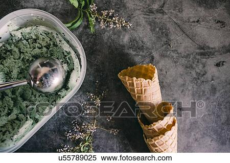 Stock Photography - Mint chocolate chip ice cream with cones. Fotosearch