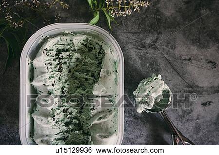 Mint chocolate ice cream with scoop View Large Photo Image Stock Photograph - Mint chocolate ice cream with scoop. Fotosearch