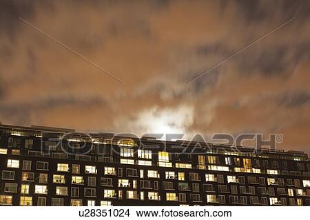 Modern apartment block at dusk View Large Photo Image Picture - Modern apartment block at dusk. Fotosearch