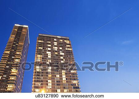 Modern apartment block at dusk View Large Photo Image Stock Image - Modern apartment block at dusk. Fotosearch