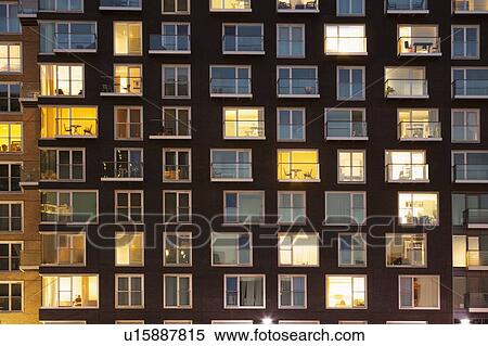 Stock Photography - Modern apartment block at dusk. Fotosearch