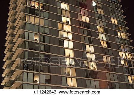Modern apartment block at night View Large Photo Image Stock Image - Modern apartment block at night. Fotosearch