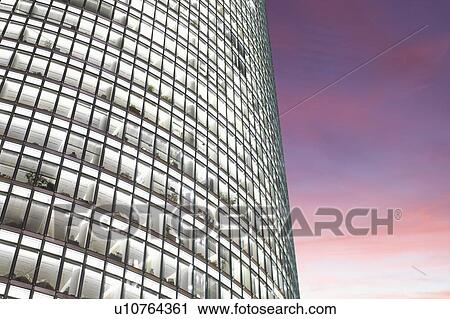 Stock Image - Modern office block at dusk. Fotosearch