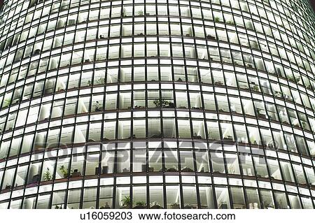Modern office block at dusk View Large Photo Image Stock Image - Modern office block at dusk. Fotosearch