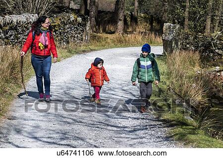 Stock Photograph - Mother and sons exploring national park, Llanaber, Gwynedd, United Kingdom. Fotosearch