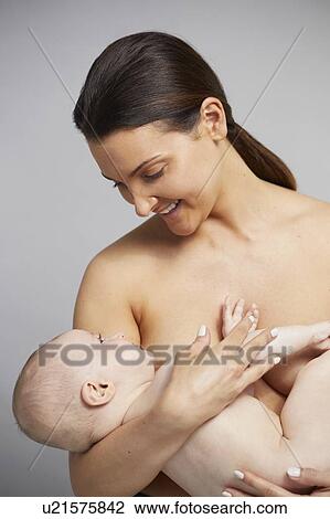 Mother cradling baby boy View Large Photo Image Stock Image - Mother cradling baby boy. Fotosearch