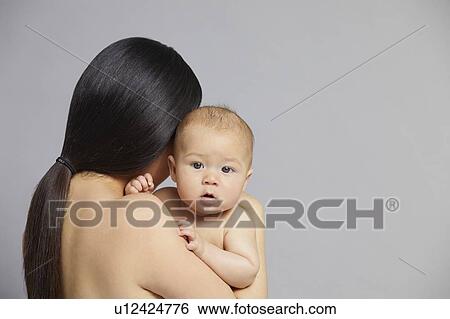 Mother hugging baby View Large Photo Image Stock Photograph - Mother hugging baby. Fotosearch